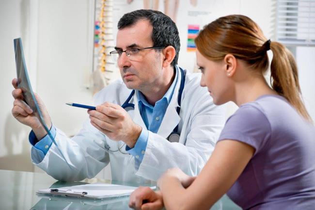 Patient learning about her x-ray.